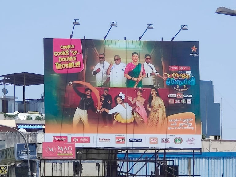 Outdoor billboard advertisement with colorful promotional content and pink neon sign