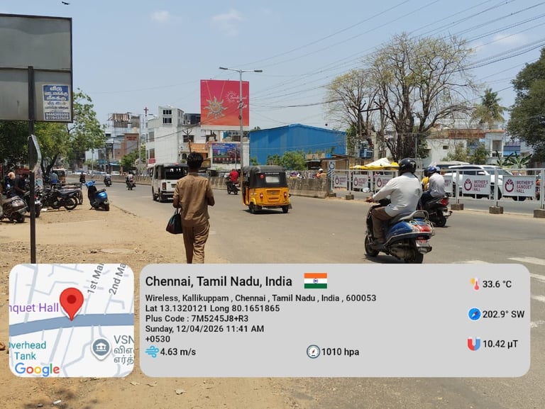 Street scene in Chennai, Tamil Nadu, India showing a busy urban road with motorcycles, auto-rickshaw, vehicles, buildings and a map overlay with location details